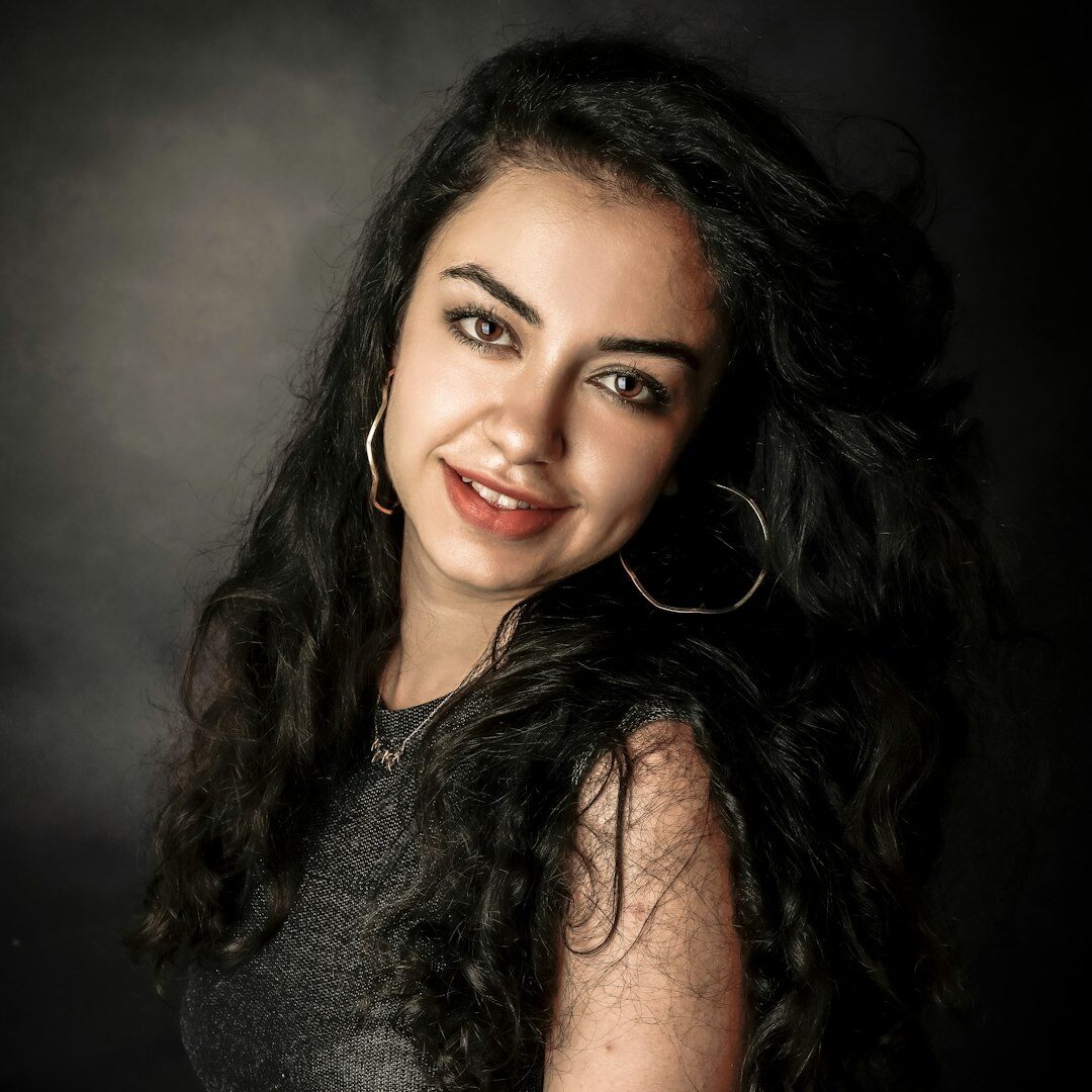 Studio portrait of an Argentine actress smiling softly